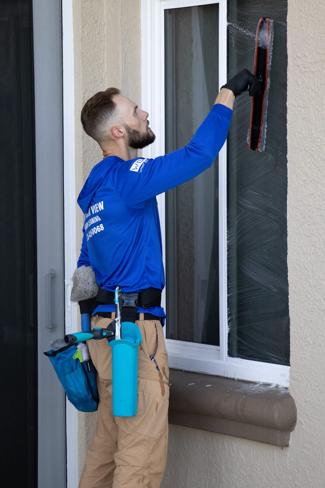 Riley Hendry cleaning windows - What Glass Window Cleaning